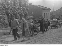 Fotothek_df_pk_0000126_029_Mann_repariert_Fahrradschlauch_-_Frauen_holen_Wasser_am_Brunnen_auf_der_Straße After World War 2 many ethnic Germans living in Poland were killed or expelled. Some were sent to Russian labor camps, a few indispensible Germans were allowed...